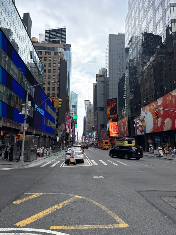 Midtown Manhattan crowds and landmarks on a July evening