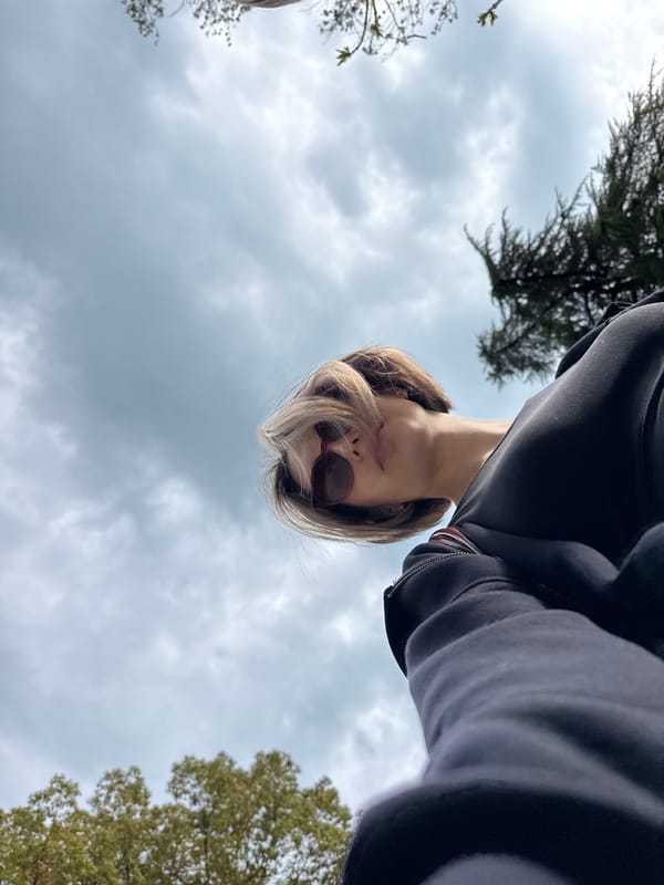 Woman documents park visit with selfies, bamboo forests, wildlife