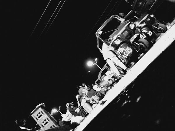 Heavy nighttime traffic and market activity documented in Bukuru