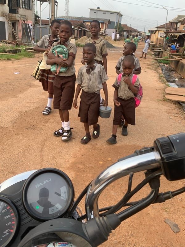 Morning commute on foot through Shagamu's unpaved streets