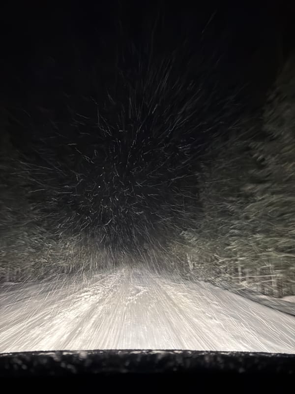 Vehicle passes through automated car wash facility