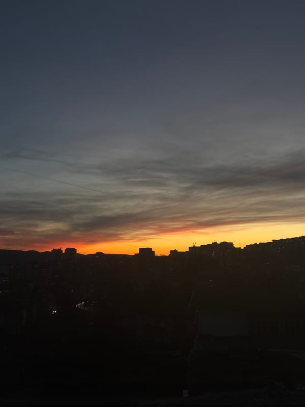 Sunset documented on Veliko Tarnovo streets with parked cars