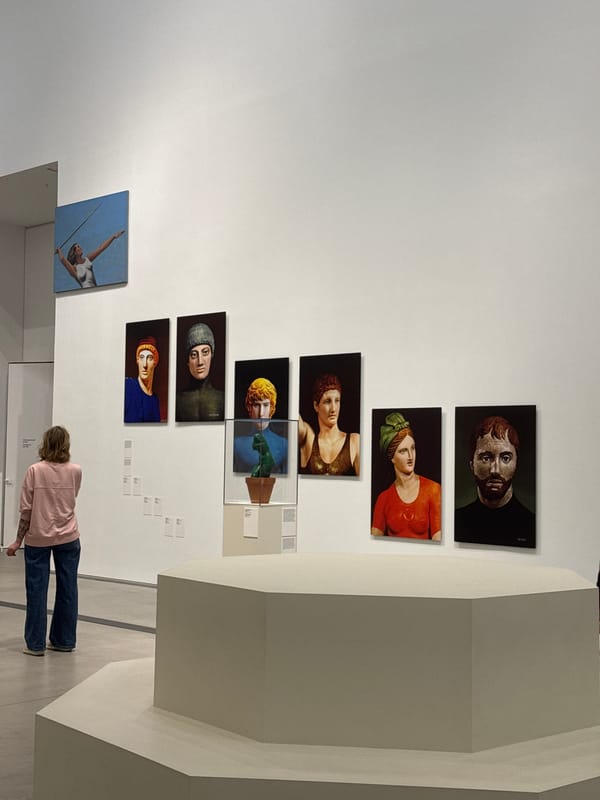Gallery visitor views portrait collection in Moscow museum