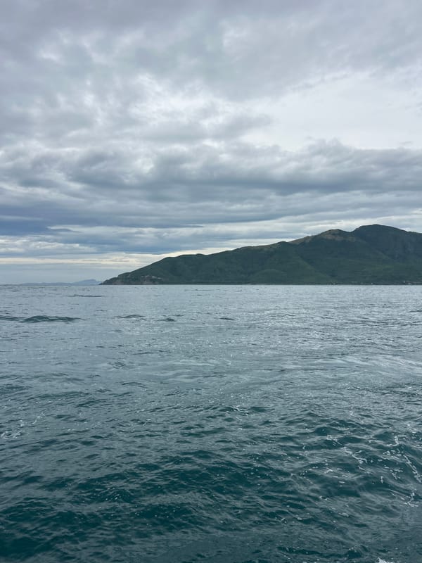 Passenger boats crossing choppy waters off Nha Trang's coastline