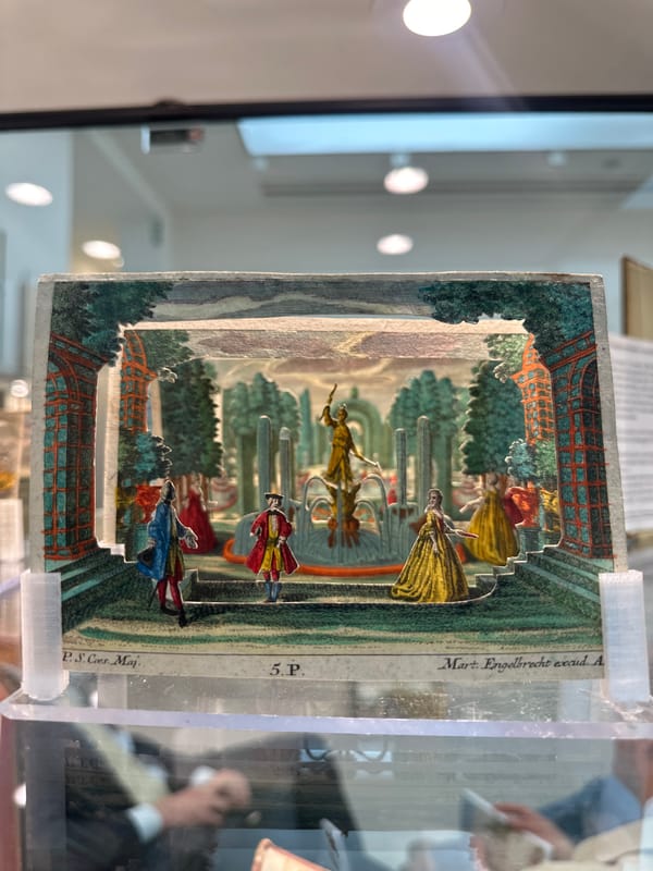 Visitor documents vintage displays at London rare book fair