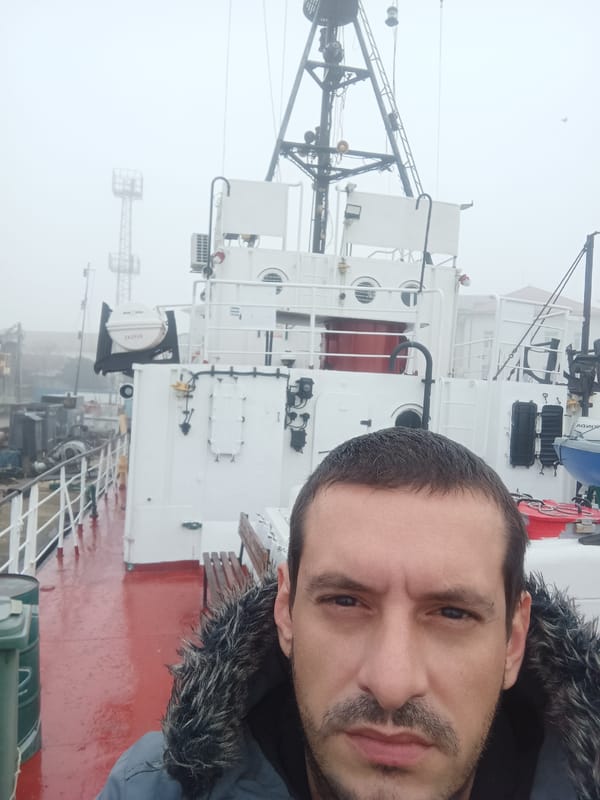 Man takes selfie on ship in foggy Burgas harbor
