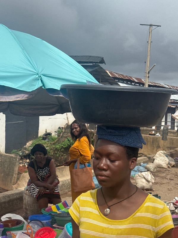 Street life and commerce moving through Onitsha's busy market corridor