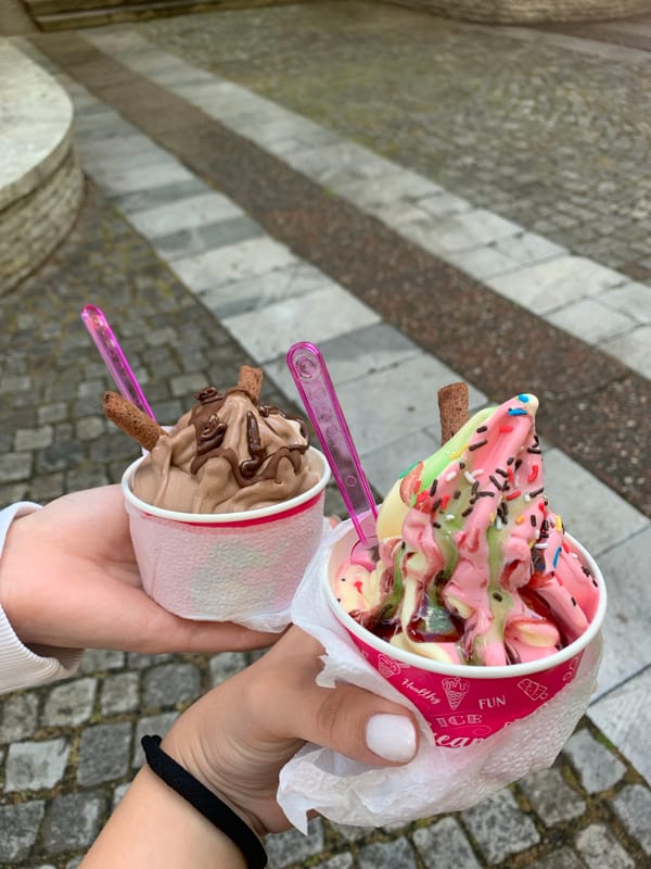Ice cream shared on cobblestone street in Kyustendil, Bulgaria