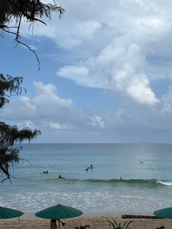 Rainy morning at Karon Beach, street and shoreline scenes