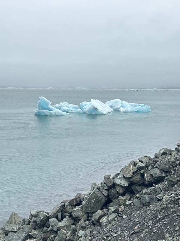 Glacier edge meets water in Icelandic lagoon scene