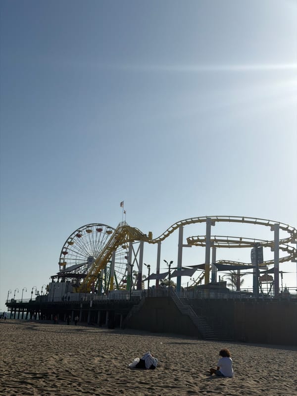 Santa Monica Pier photographed showing Ferris wheel, roller coaster