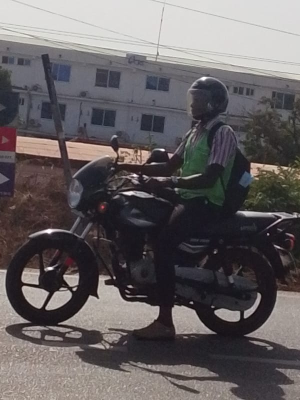 Motorcyclist in green vest observed on Tamale road