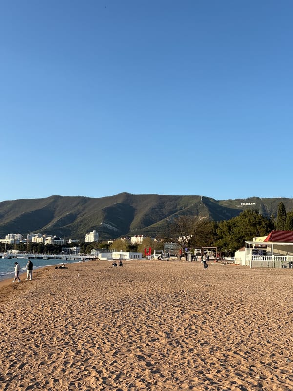 Visitor documents sunset beach experience in Gelendzhik, Russia