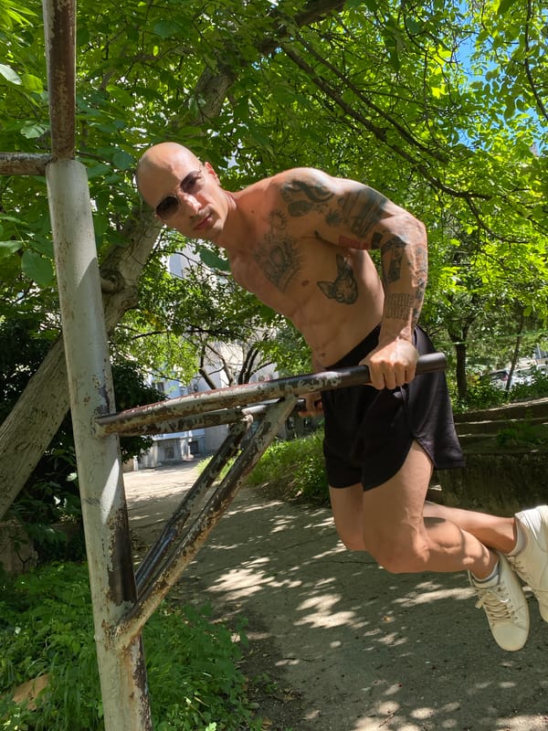 Man exercises at outdoor fitness area in Pleven, Bulgaria