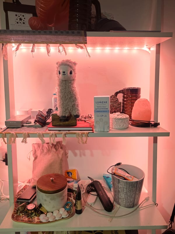 Red-lit shelves packed with personal objects in Sofia