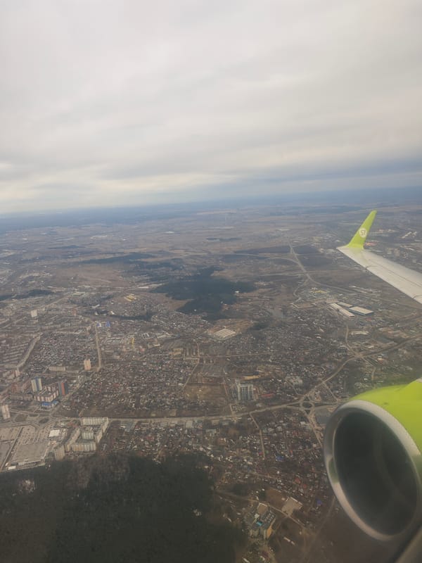 S7 passenger documents aerial views of Novosibirsk during flight