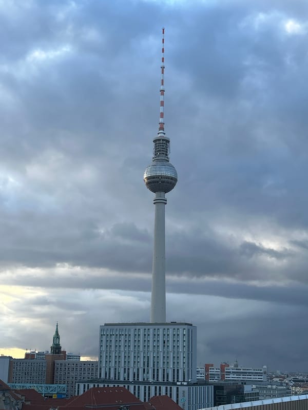 Berlin TV Tower photographed under cloudy afternoon sky