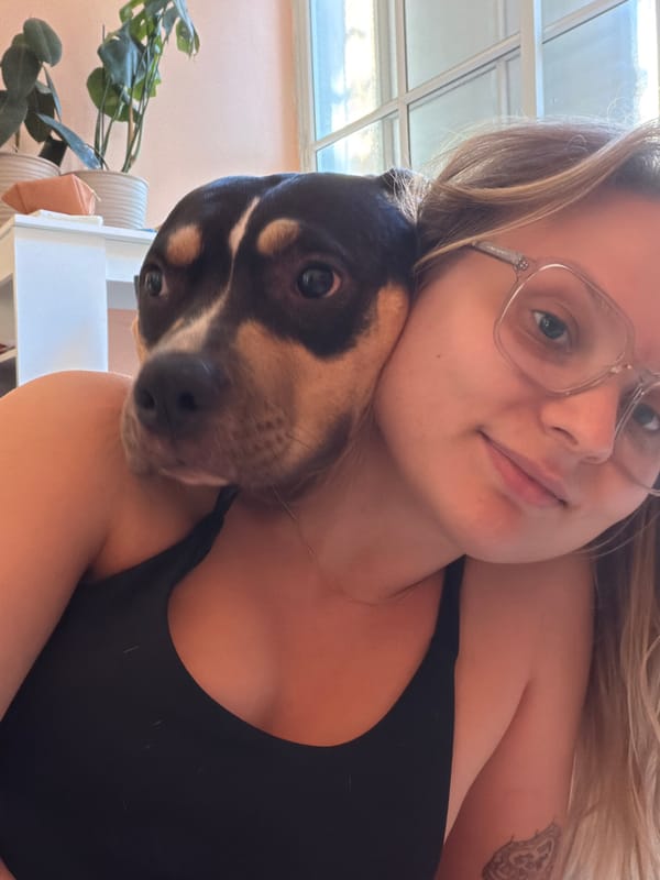 Woman and tri-colored dog photographed together in Tel-Aviv
