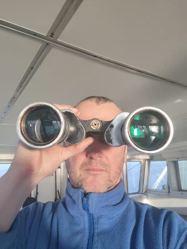 Man with binoculars spotted on boat in Rusanovo