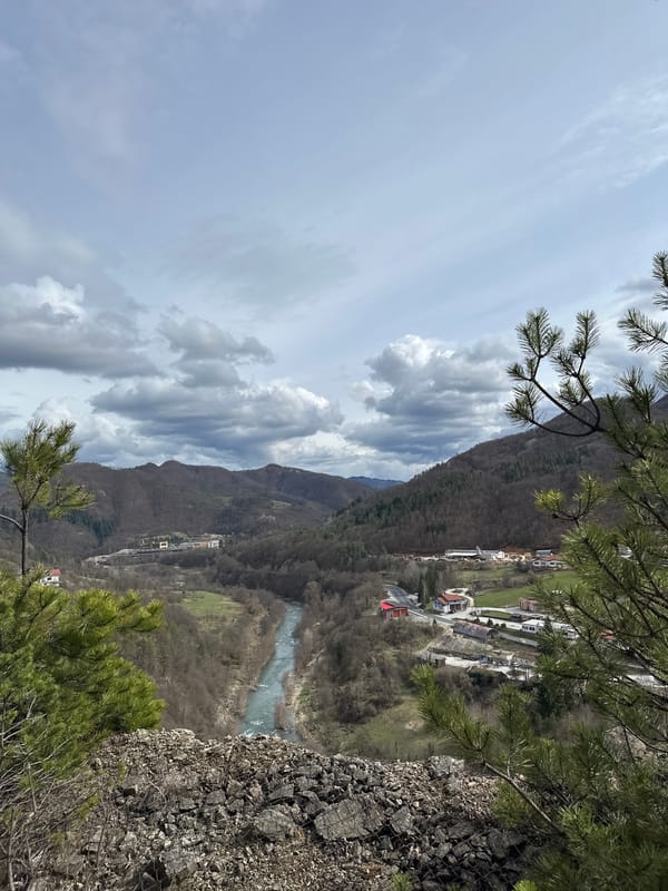Aerial view captures Srednogortsi city and mountain landscape