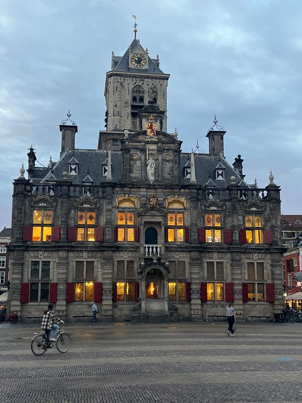 Delft's Markt square at dusk, City Hall and Oude Kerk