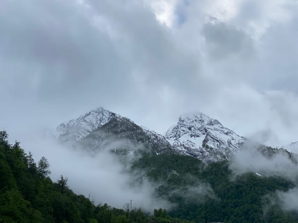 Foggy conditions observed over snow-capped mountains in Estosadok, Russia