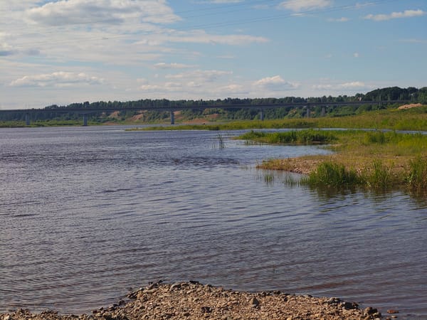 Calm river and rocky shoreline near Velikiy Ustyug, Russia