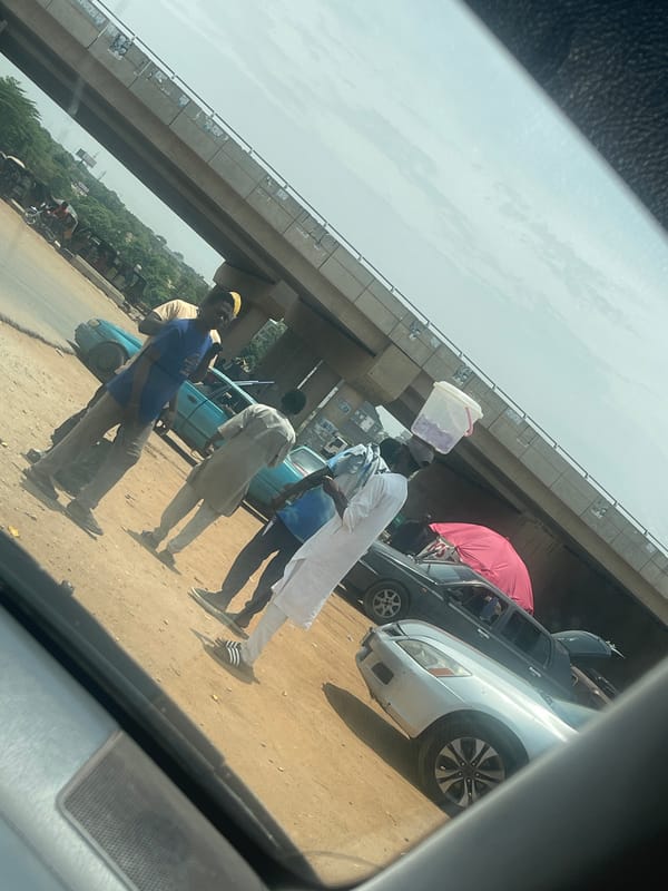 Woman travels through Galadimawa Village by car
