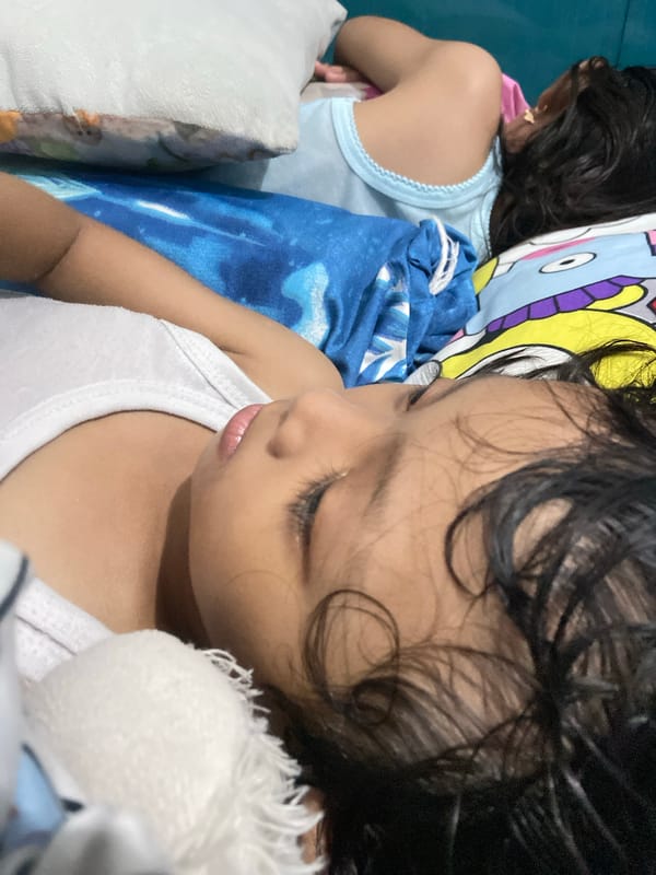 Children rest quietly in bedroom during early morning hours