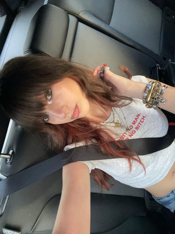 Woman rests in car seat in Raanana, Israel