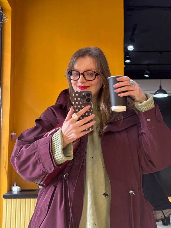 Woman enjoys morning coffee at Izhevsk cafe