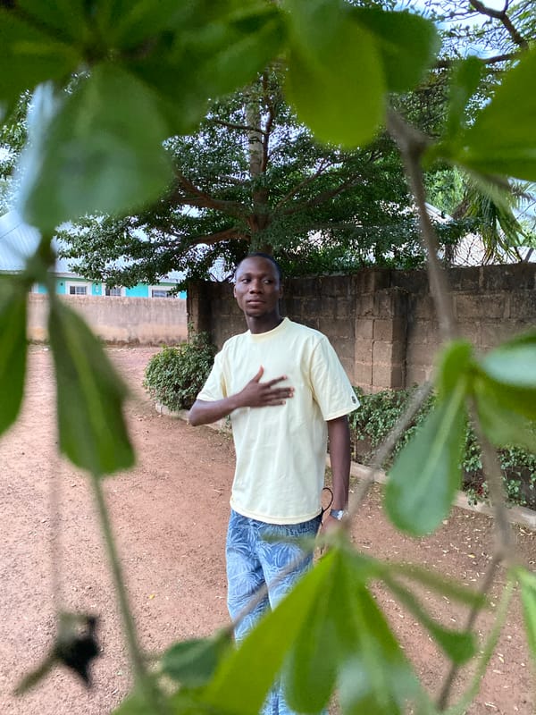 Young man photographed in everyday moments around Bukuru, Nigeria