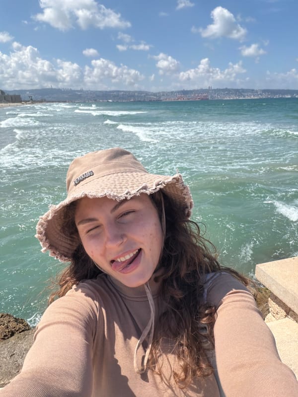 Woman takes seaside selfies on Kiryat Yam promenade