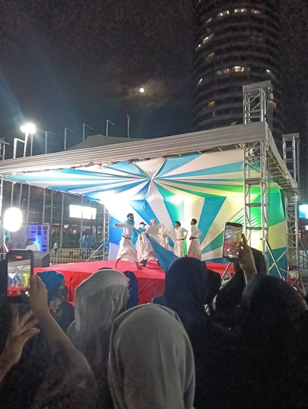 Cultural performances and crowds at a Nairobi nighttime event