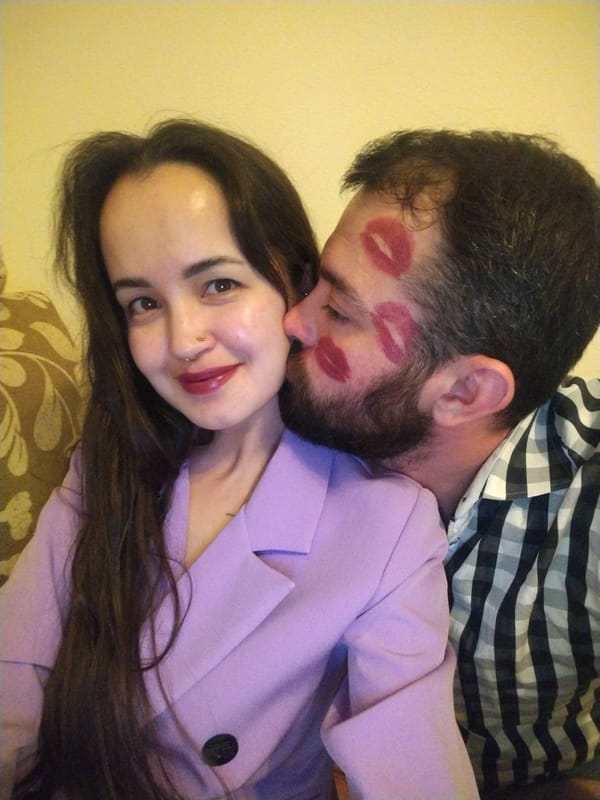 Couple shares intimate moments at home with dog, child