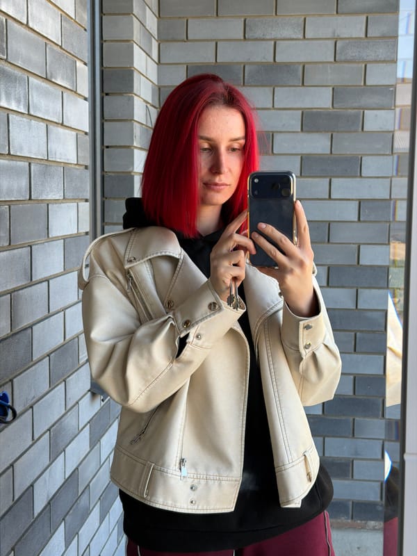 Woman takes selfie while holding keys in Chaikovsky