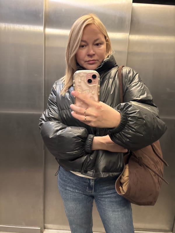 Woman takes selfie in elevator in Izhevsk