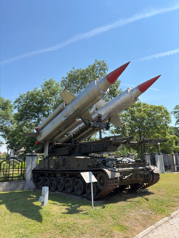 Visitors document Soviet military exhibits at Bulgarian aviation museum