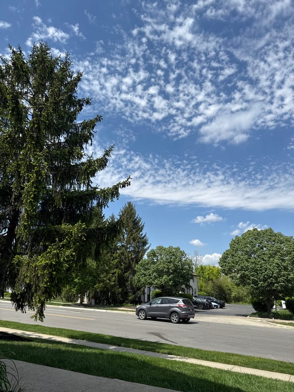 Clear skies, white clouds observed over Columbus residential area