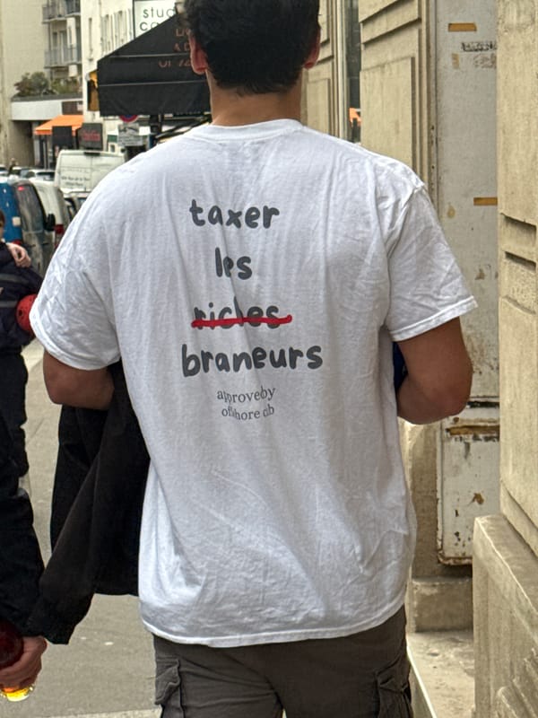 Man spotted wearing anti-tax protest shirt in Paris