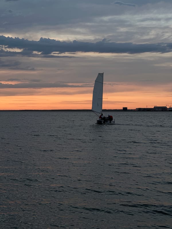Sunset sailboat scene documented over Kokshetau waters