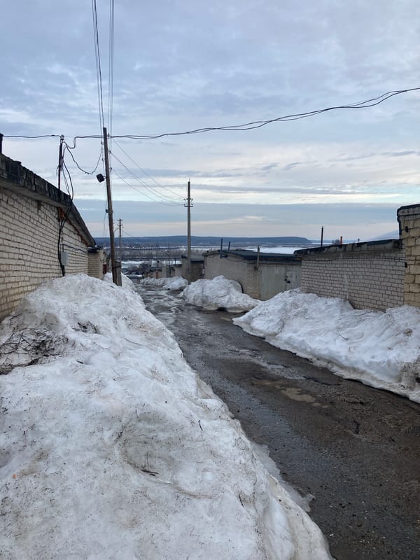 Spring snowmelt creates slushy conditions in Chaikovsky alleyway