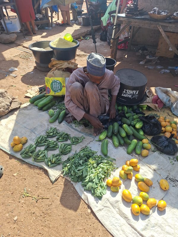 Vendors sell dried goods at Kakuri Gwari market