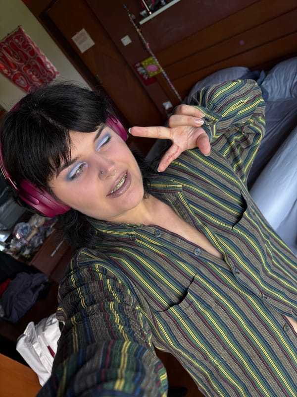 Selfie session with bold makeup and headphones, Thailand