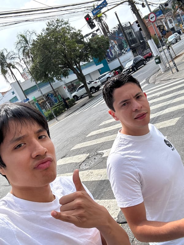 Young men take street selfie in downtown São Paulo