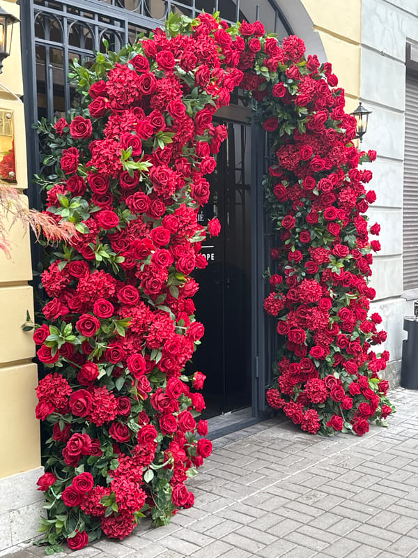 Street scene captured in Saint Petersburg with flowers, café, motorcycle
