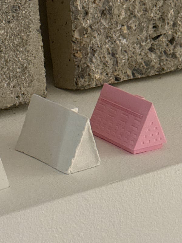 Architectural workspace documented in Milan with models and materials