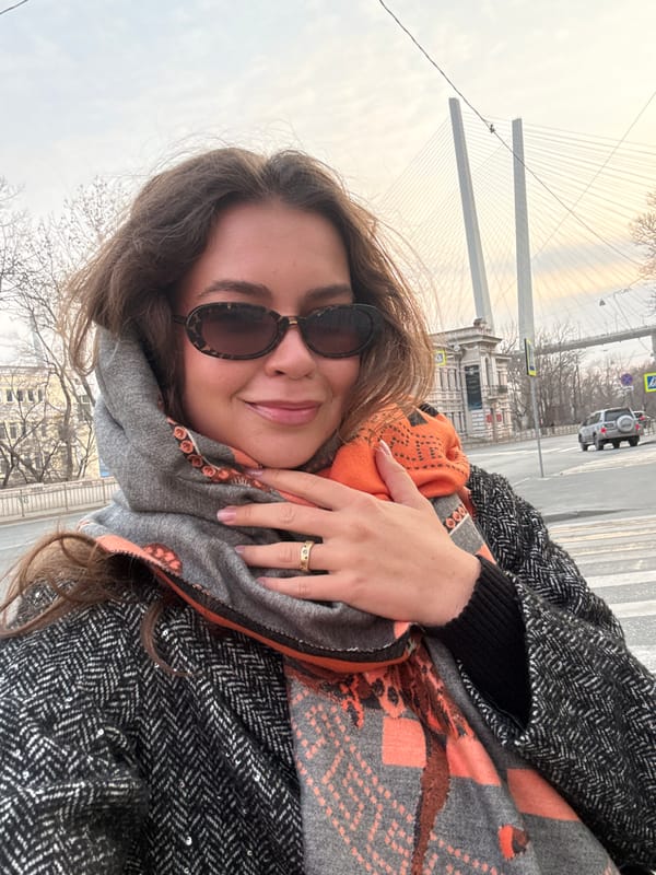 Woman takes selfie in Vladivostok wearing patterned scarf