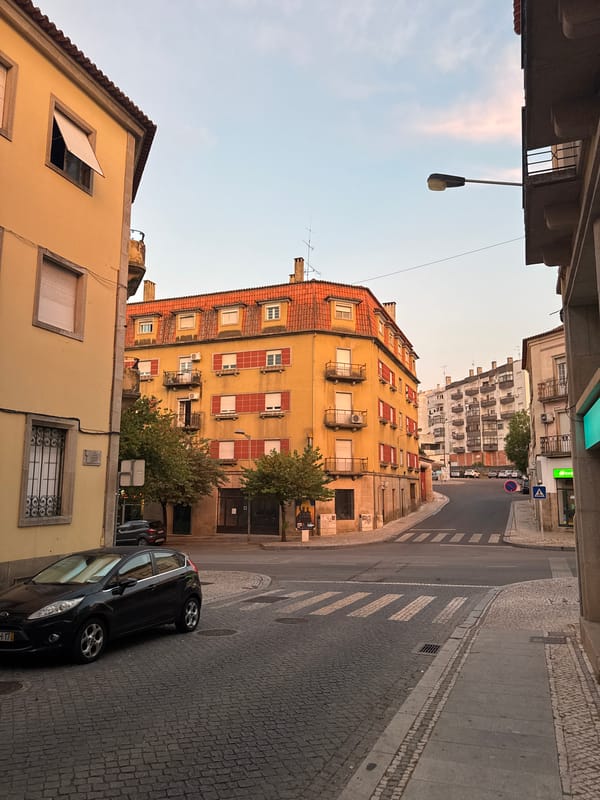 Castelo Branco streets glow under a summer evening sunset