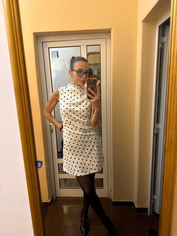 Woman in polka dot dress photographed in Pleven interior